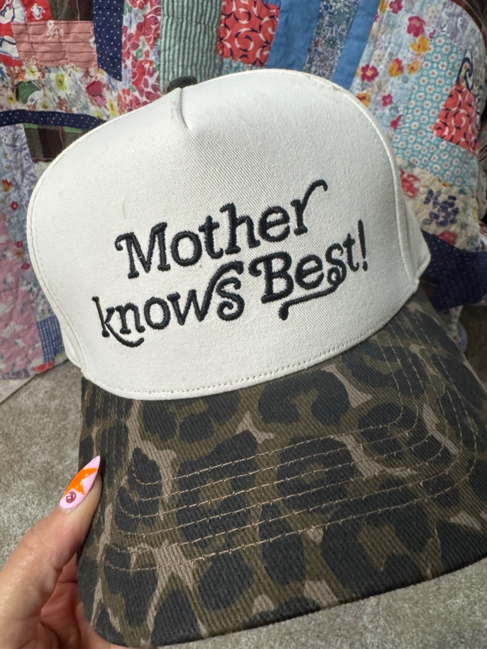 mother knows best trucker hat